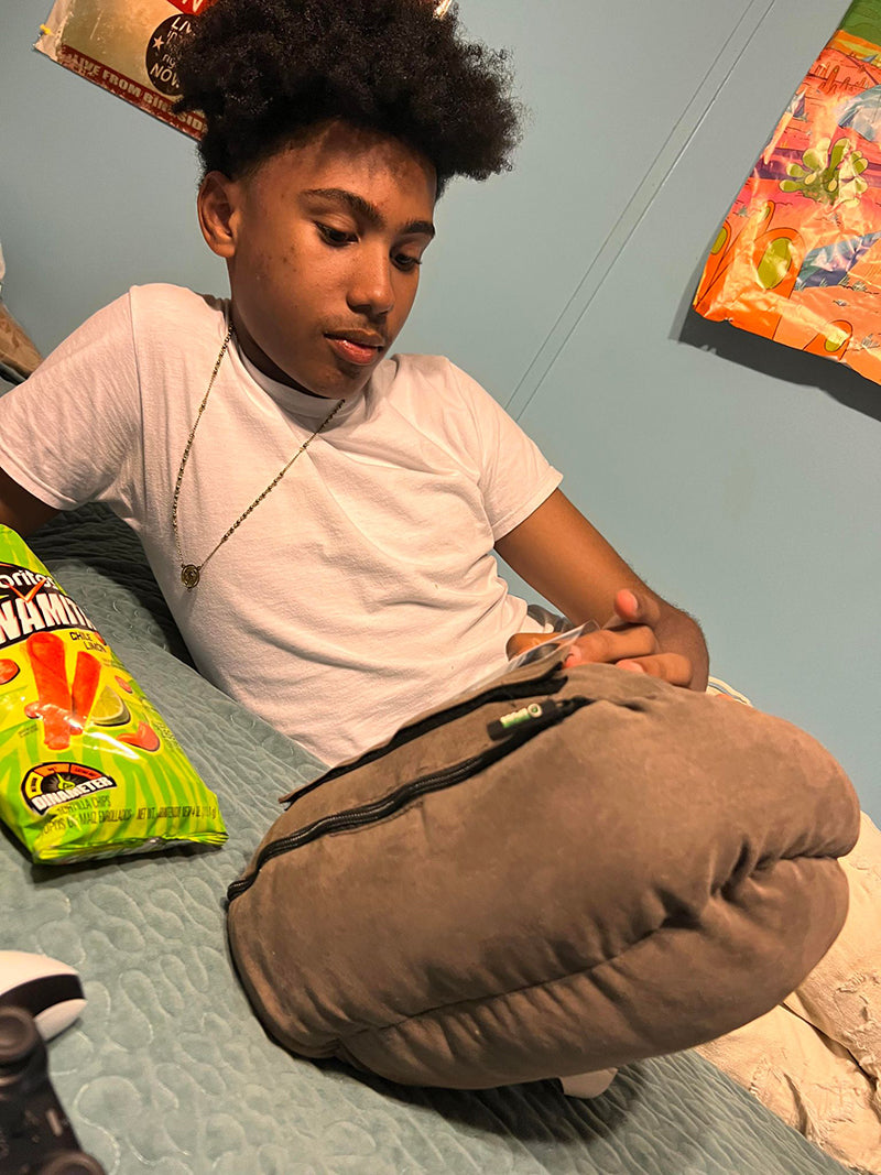 Teen child kid with smartphone cell phone potato pillow phone holder phone stand phone accessory gaming watching videos scrolling phone comfortable phone use